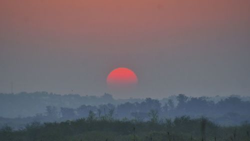 Scenic view of landscape at sunset