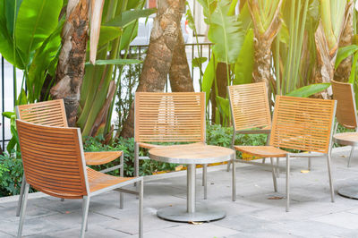 Empty chairs and tables in park