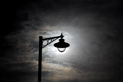 Low angle view of street light against sky