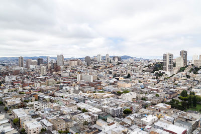 High angle view of city buildings against sky