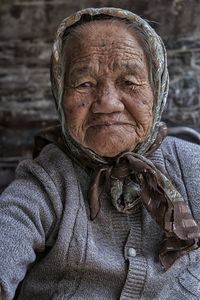 Close up portrait of woman wearing scarf