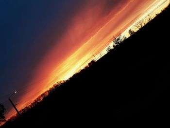 Low angle view of dramatic sky during sunset