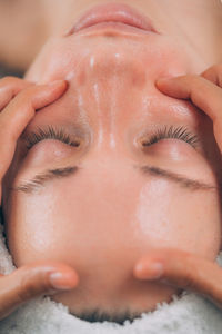 Close-up of woman getting massage therapy at spa