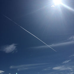 Low angle view of vapor trails in sky