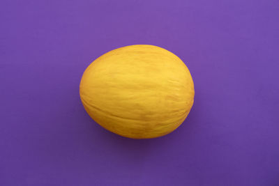 High angle view of lemon against blue background