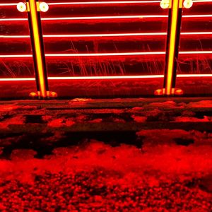 High angle view of illuminated red staircase at night