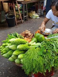 Woman selling vegetables in market