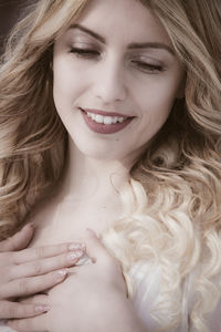 Close-up of beautiful young woman with blond hair