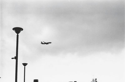 Low angle view of airplane flying in sky