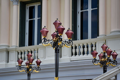 Low angle view of street light against building