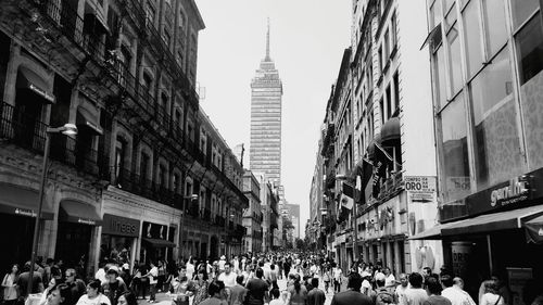 People on street amidst buildings