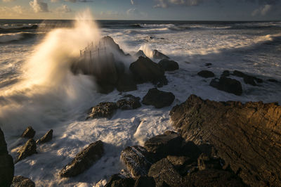 Scenic view of rocks at sea shore