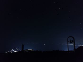 Low angle view of illuminated building against sky at night