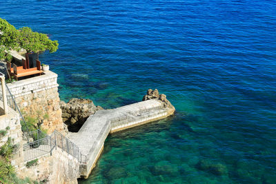 High angle view of sea against blue sky