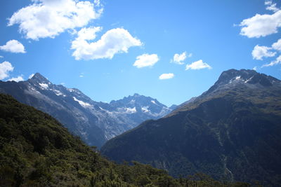 Scenic view of mountains against cloudy sky