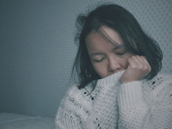 Close-up of young woman with eyes closed