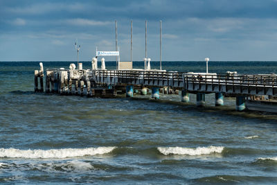 Pier over sea against sky