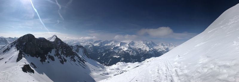 Scenic view of snowcapped mountains against sky