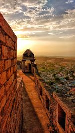 Ancient temple against sky during sunset