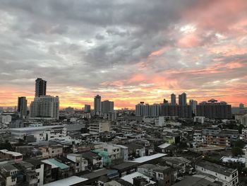 High angle view of buildings against sky during sunset