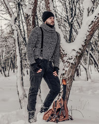 Woman standing on snow covered land