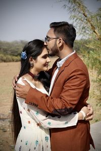 Young couple standing outdoors