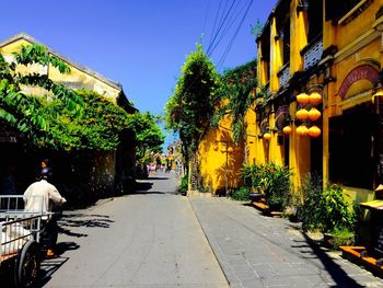 Street in city against clear sky