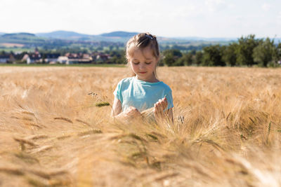 Boy standing on field