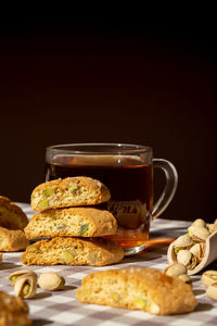 Biscotti cantuccini cookie biscuits with pistachios and lemon peel shortbread. cup of tea. teatime