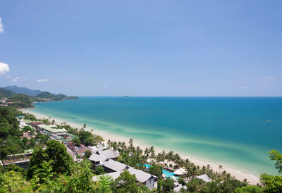 High angle view of sea against blue sky