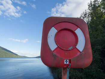 Close-up of telephone booth against sky