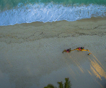 People swimming in sea