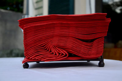 Close-up of napkins stacked on table