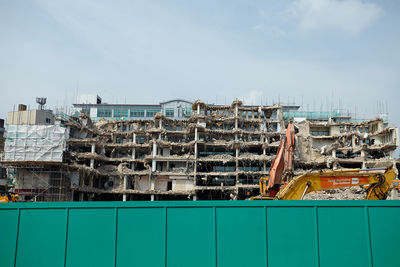 Stack of construction site against sky