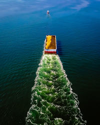 Aerial view of cargo ship in sea