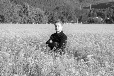 Portrait of young man on field