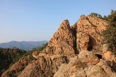 Scenic view of rocky mountains against clear sky