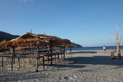 Thatched roof huts on beach