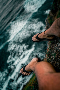 Low section of man legs in water