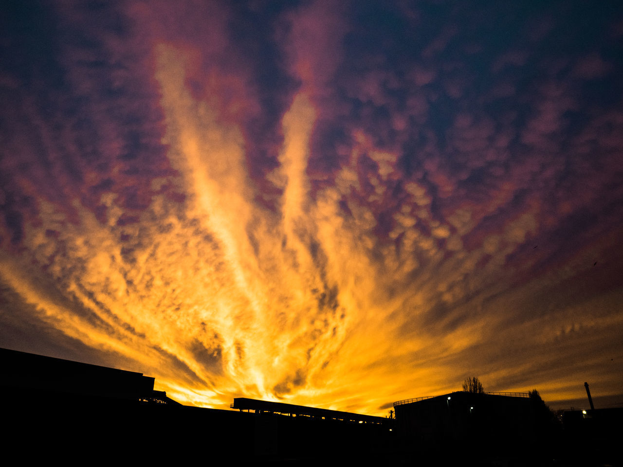 sunset, sky, built structure, architecture, silhouette, building exterior, low angle view, cloud - sky, orange color, dramatic sky, cloudy, city, building, beauty in nature, cloud, scenics, nature, outdoors, dusk, no people