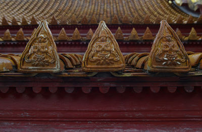 Close-up of carvings on roof