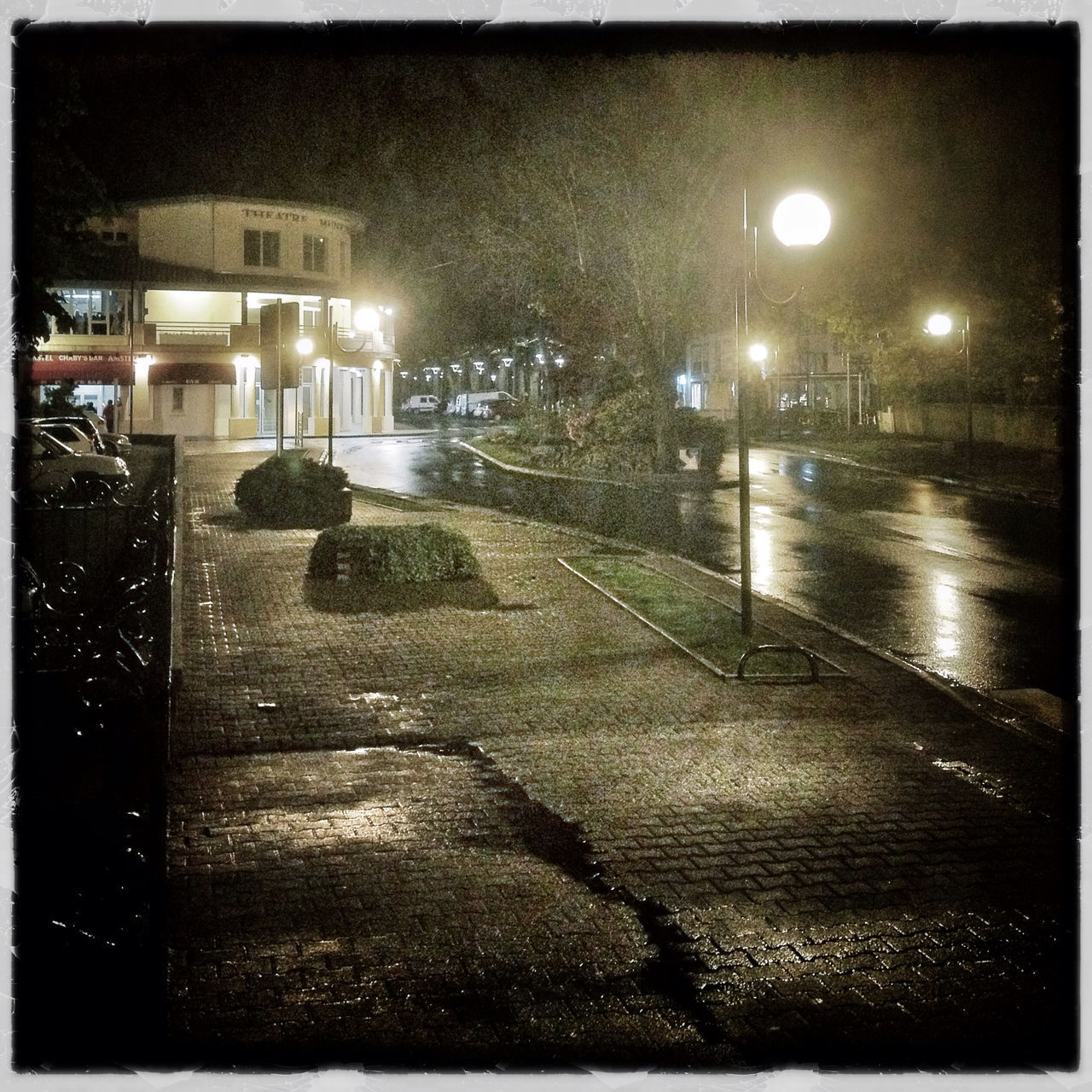 night, illuminated, street light, transfer print, lighting equipment, auto post production filter, built structure, building exterior, architecture, street, water, city, wet, rain, reflection, transportation, incidental people, outdoors, weather, no people