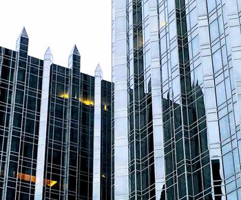 Low angle view of skyscrapers against sky