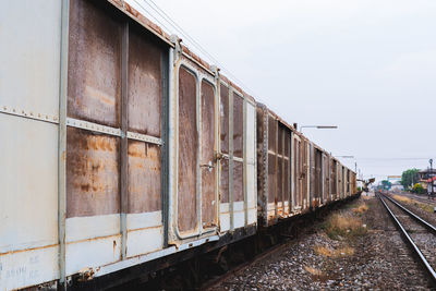 Train on railroad tracks against sky