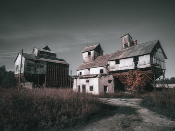 Old building in field against sky