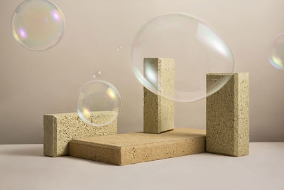 Close-up of bubbles flying by blocks over table