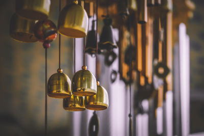 Close-up of wind chimes for sale in store