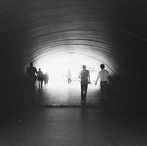 Woman with arms raised in background
