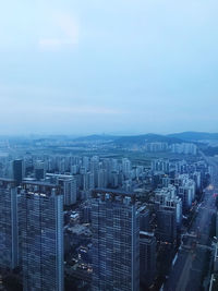 High angle view of buildings in city against sky