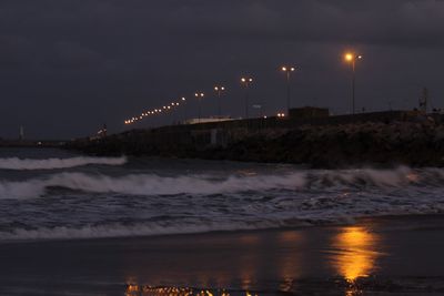 Scenic view of sea against sky at night